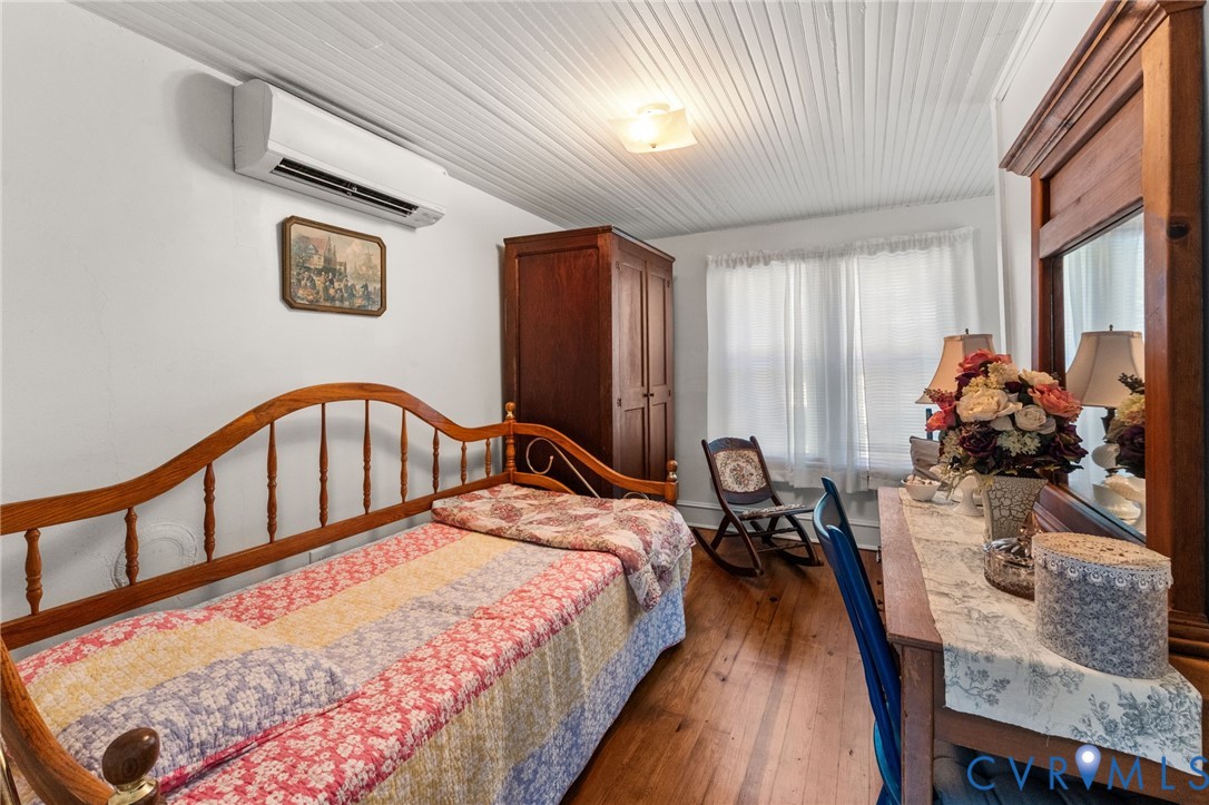 738 Bowlers Road Center Cross, VA 22437 - Photo 21 of 25 Upstairs 2nd Bedroom with refinished pine floors,b