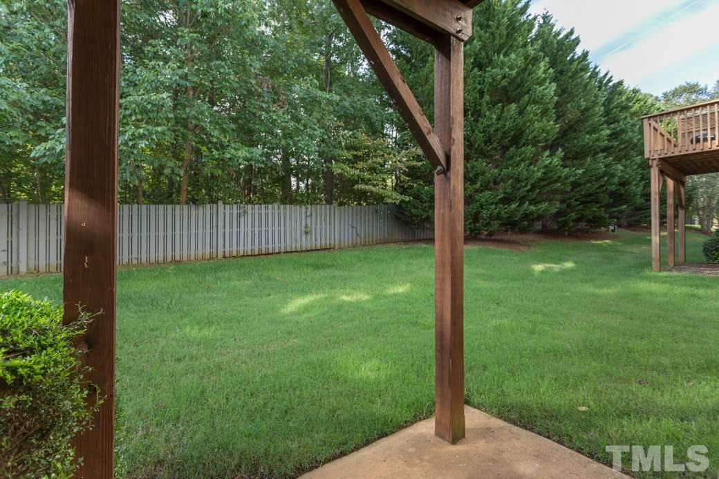 5431 Golden Arrow Lane Raleigh, NC 27613 - Photo 6 of 10 The back of the property has a nice tree lined buffer for lots of privacy. There's plenty of room for playing with your friends and family.
