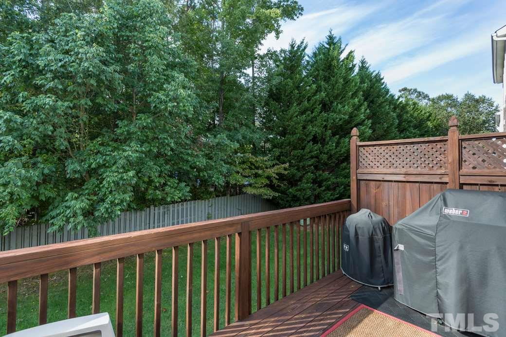 5431 Golden Arrow Lane Raleigh, NC 27613 - Photo 7 of 10 The deck is off the family room and overlooks the private yard.