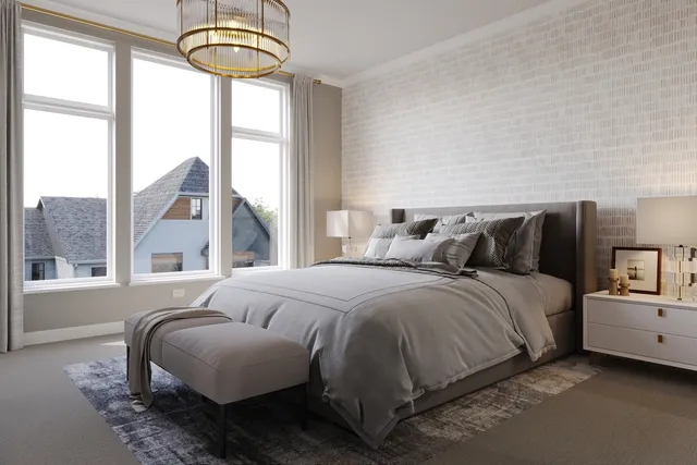 a bedroom with a bed and a large window