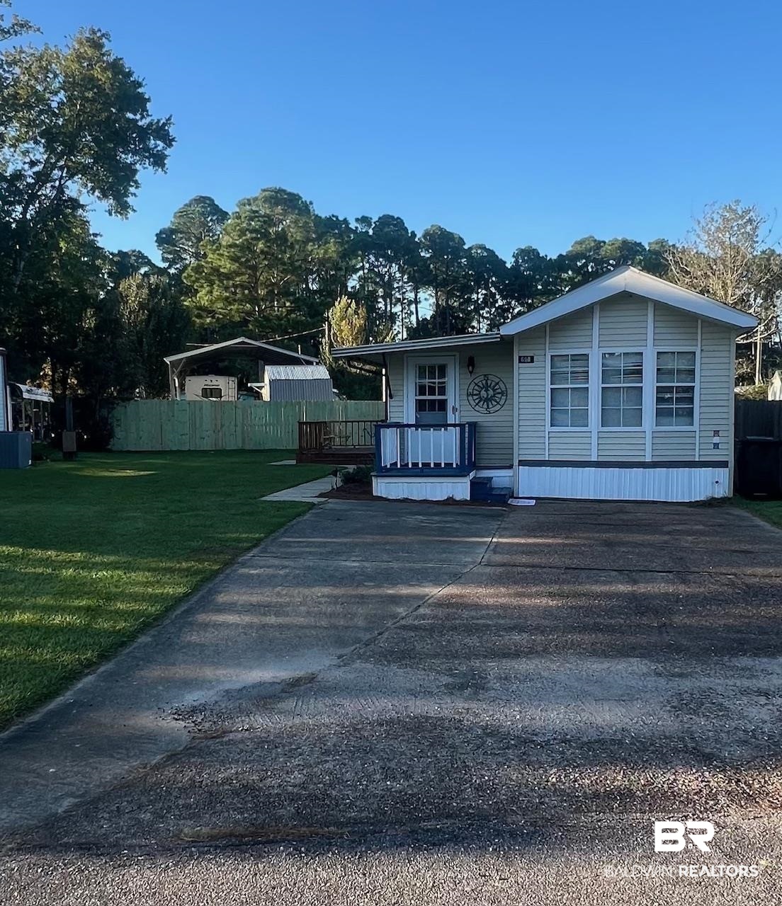 698 Escambia Loop Lillian, AL 36549 - Photo 2 of 16 View of front of property with a front yard