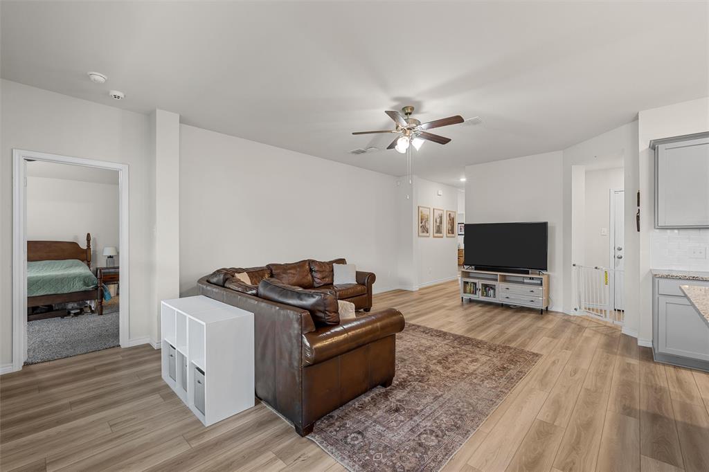 10712 Peperak Court Waco, TX 76708 - Photo 6 of 25 a living room with furniture and a flat screen tv