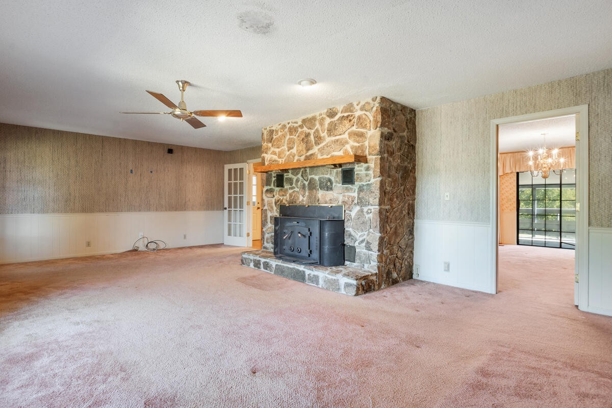 1471 New Hope Church Road Tunnel Hill, GA 30755 - Photo 11 of 45 a view of a livingroom with a fireplace and a large window