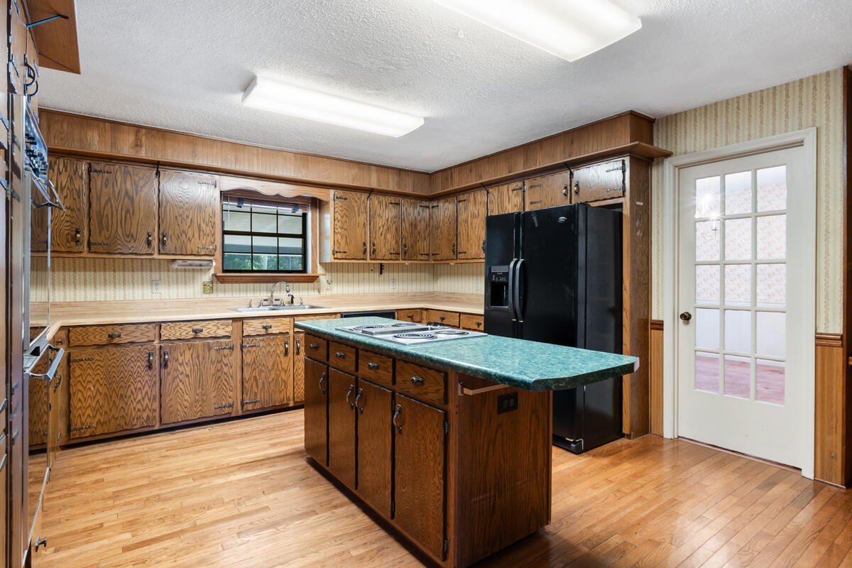 1471 New Hope Church Road Tunnel Hill, GA 30755 - Photo 17 of 45 a kitchen with stainless steel appliances granite countertop a stove a refrigerator and a sink