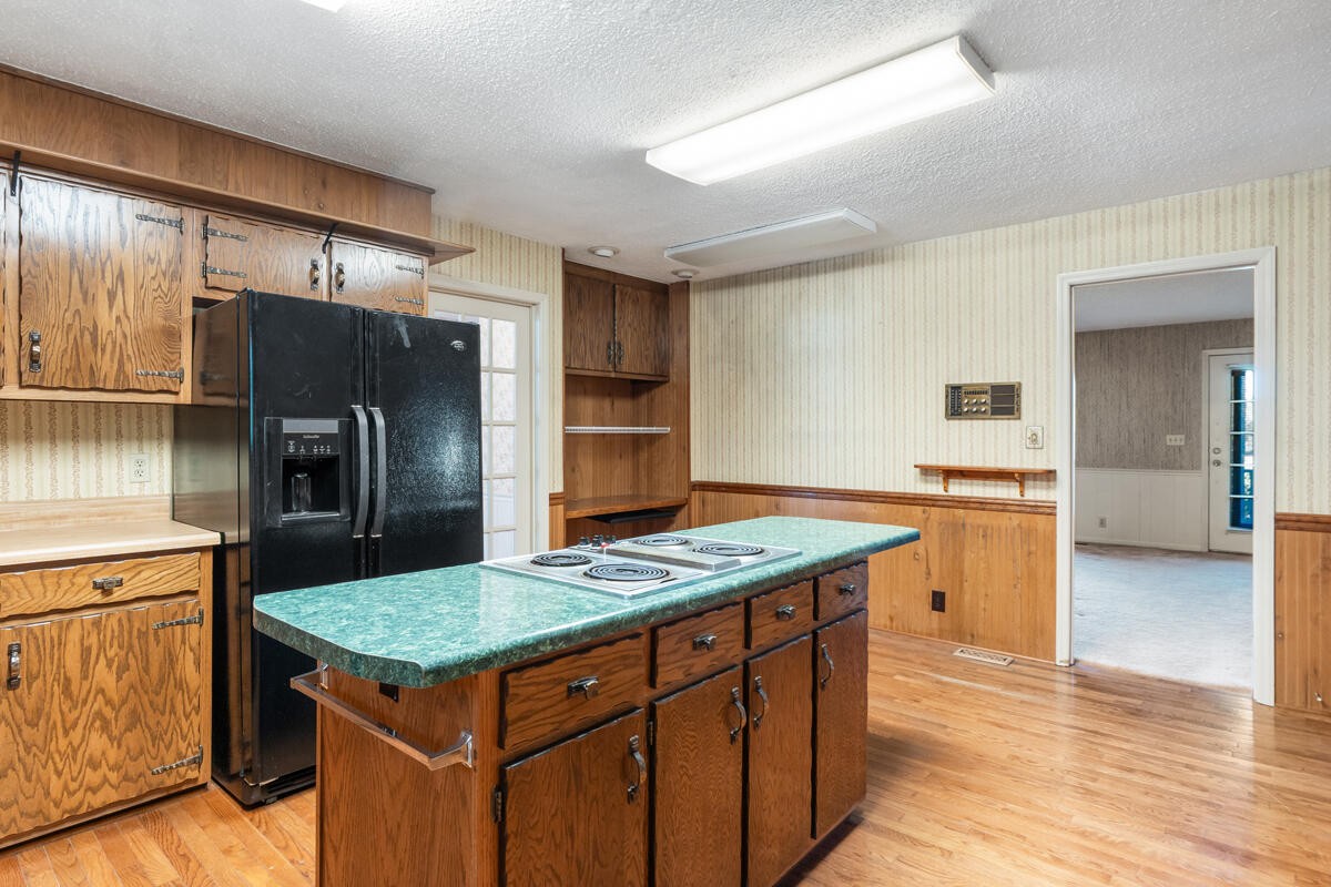 1471 New Hope Church Road Tunnel Hill, GA 30755 - Photo 19 of 45 a kitchen with a stove a refrigerator and a sink