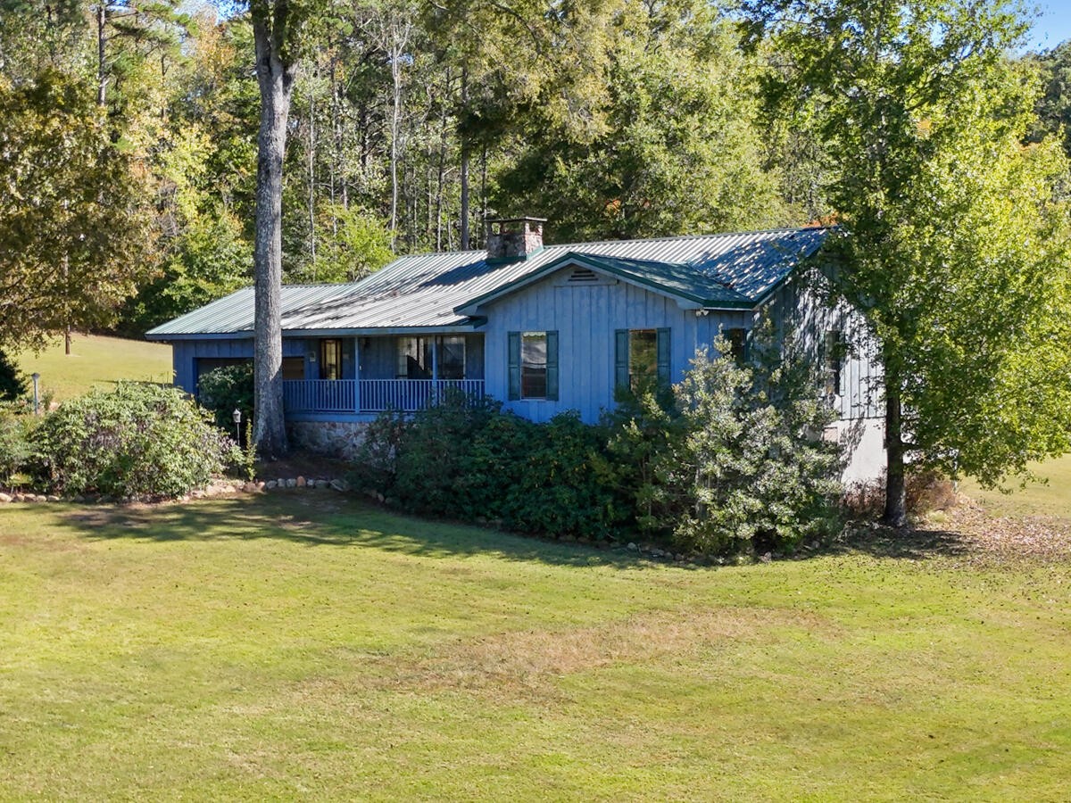 1471 New Hope Church Road Tunnel Hill, GA 30755 - Photo 2 of 45 a front view of a house with a garden