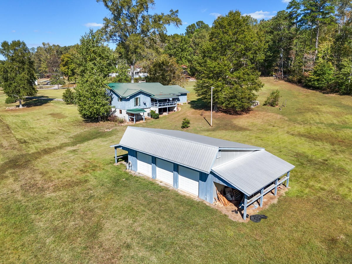 1471 New Hope Church Road Tunnel Hill, GA 30755 - Photo 42 of 45 a view of a patio with a table and a chair