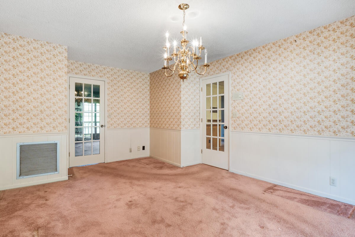 1471 New Hope Church Road Tunnel Hill, GA 30755 - Photo 9 of 45 a view of a big room with windows and chandelier