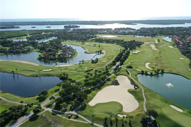 a view of a lake with a swimming pool
