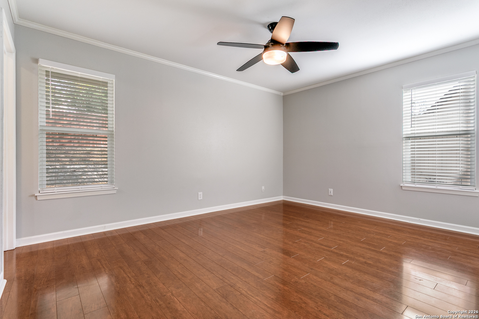 5302 Fair Ridge Drive San Antonio, TX 78228 - Photo 17 of 24 wooden floor in an empty room with a window