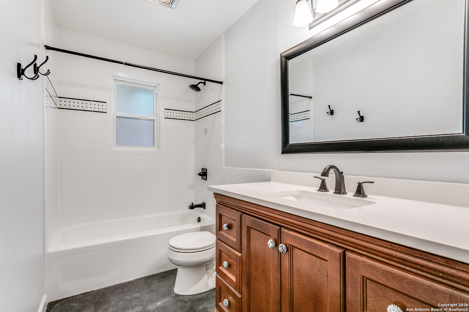 5302 Fair Ridge Drive San Antonio, TX 78228 - Photo 21 of 24 a bathroom with a sink a toilet and a bathtub