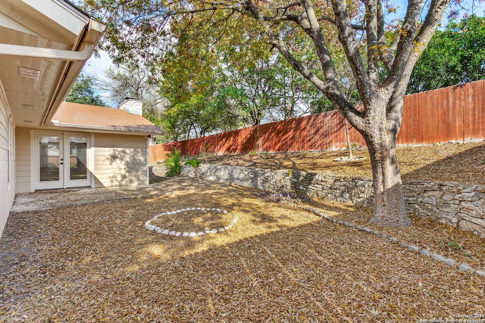 5302 Fair Ridge Drive San Antonio, TX 78228 - Photo 22 of 24 a view of a backyard with large trees