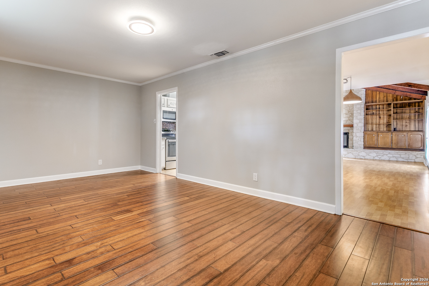 5302 Fair Ridge Drive San Antonio, TX 78228 - Photo 5 of 24 wooden floor in an empty room with a window