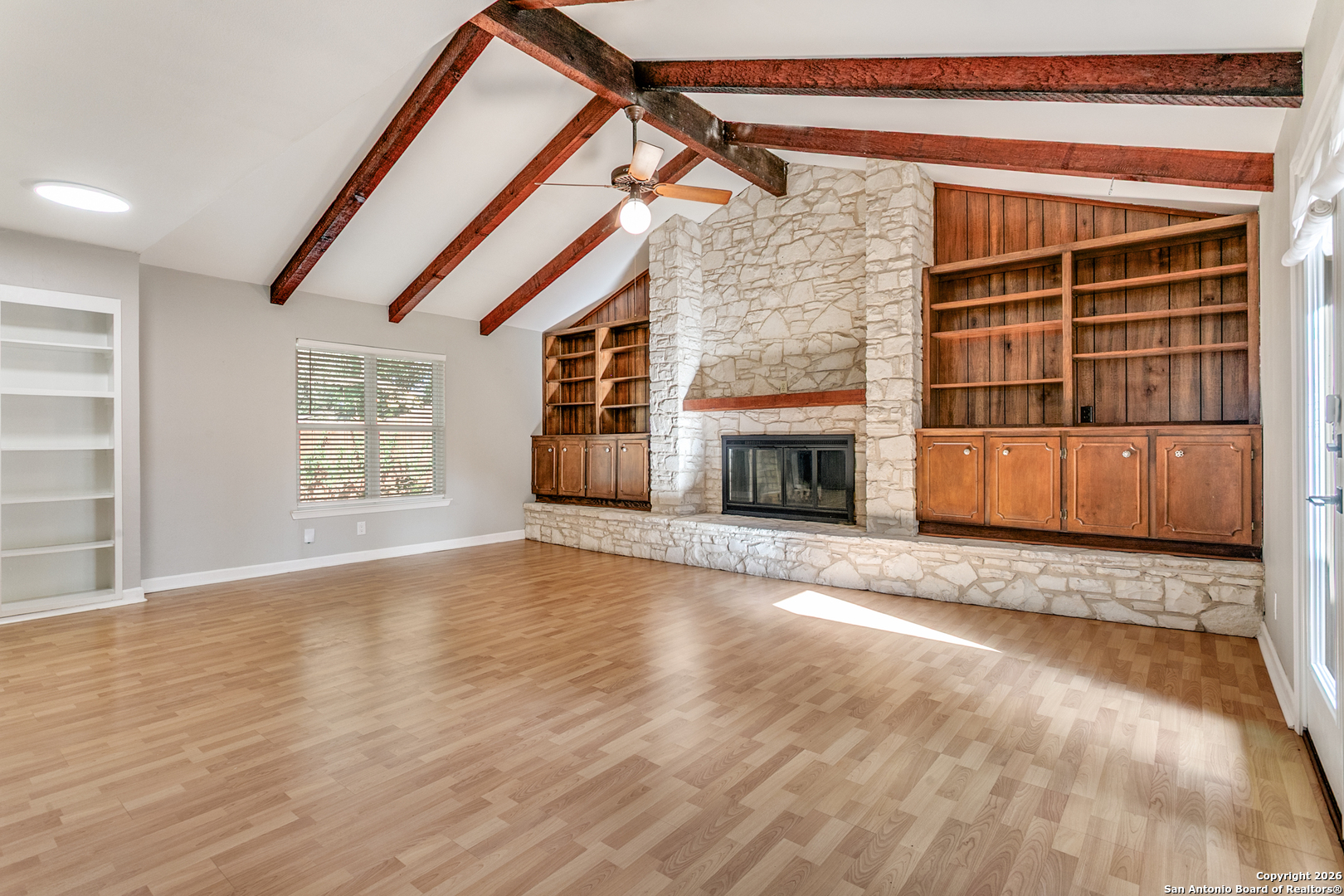 5302 Fair Ridge Drive San Antonio, TX 78228 - Photo 8 of 24 a view of empty room with wooden floor and fireplace