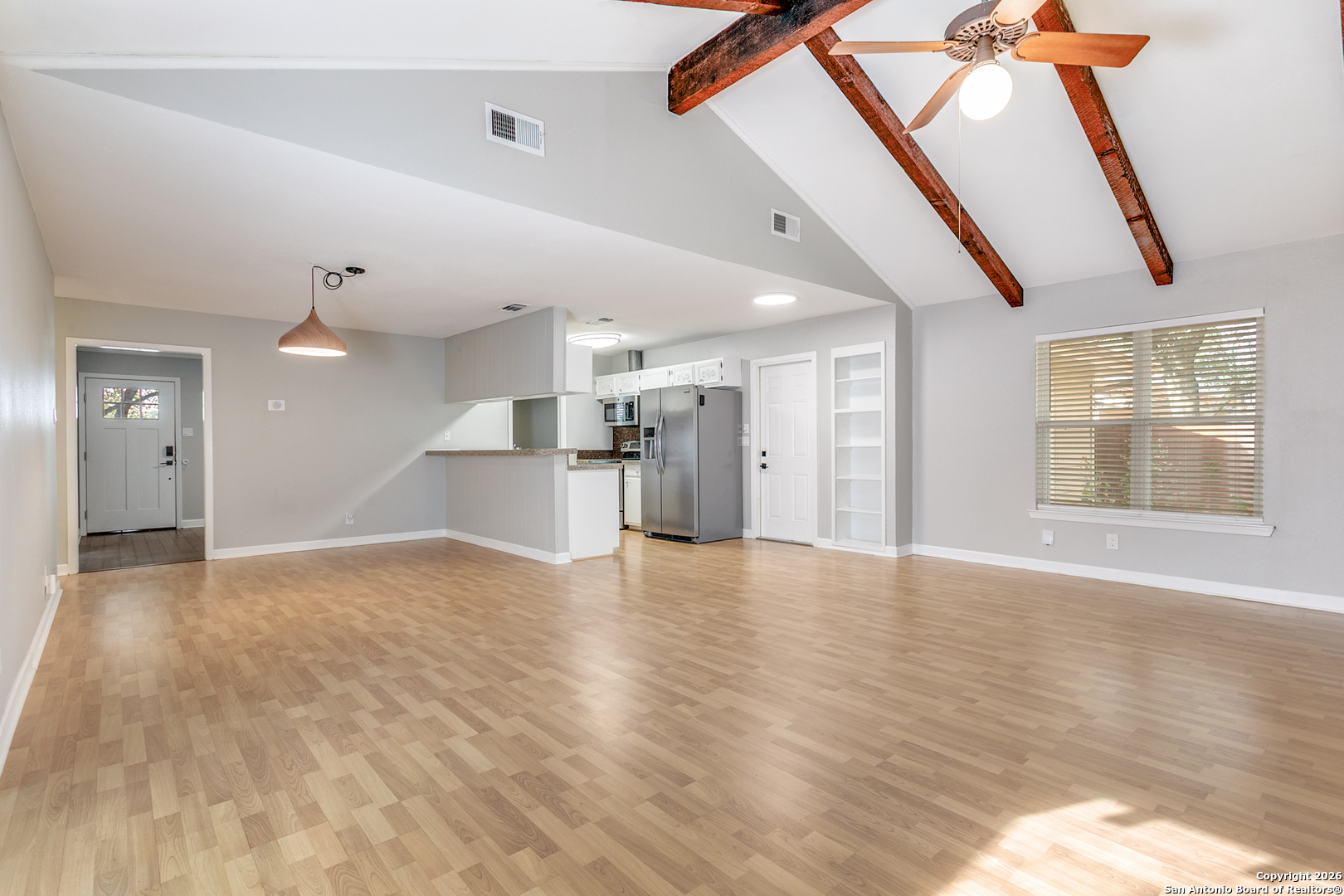5302 Fair Ridge Drive San Antonio, TX 78228 - Photo 10 of 24 a view of empty room with wooden floor and windows