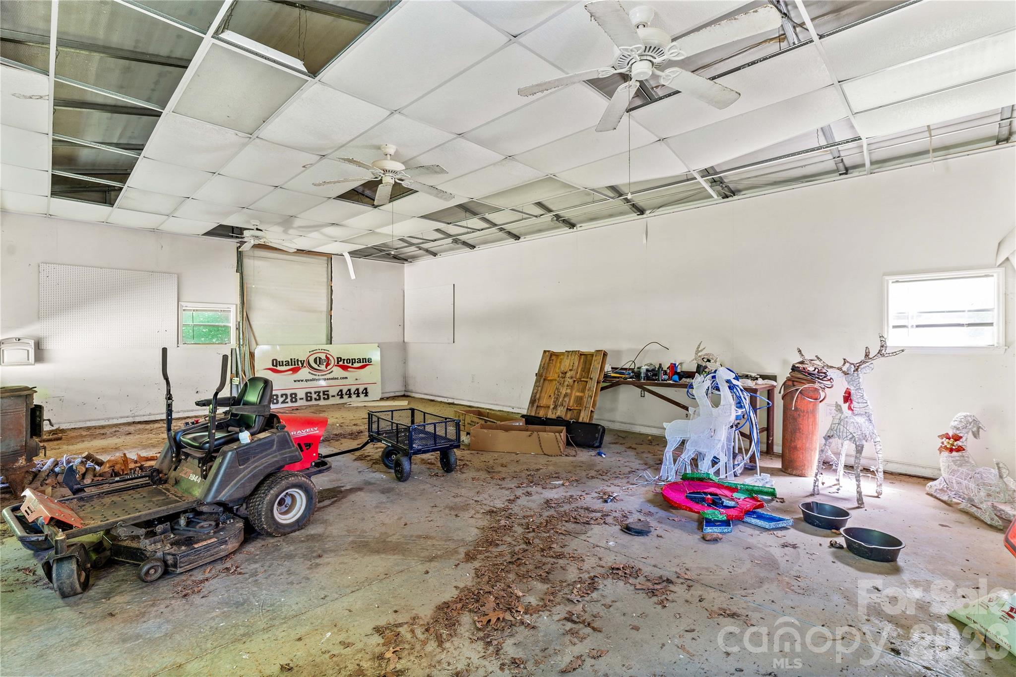 711 Spring Pointe Drive Stony Point, NC 28678 - Photo 32 of 47 a view of a garage with a lot of stuff and toys