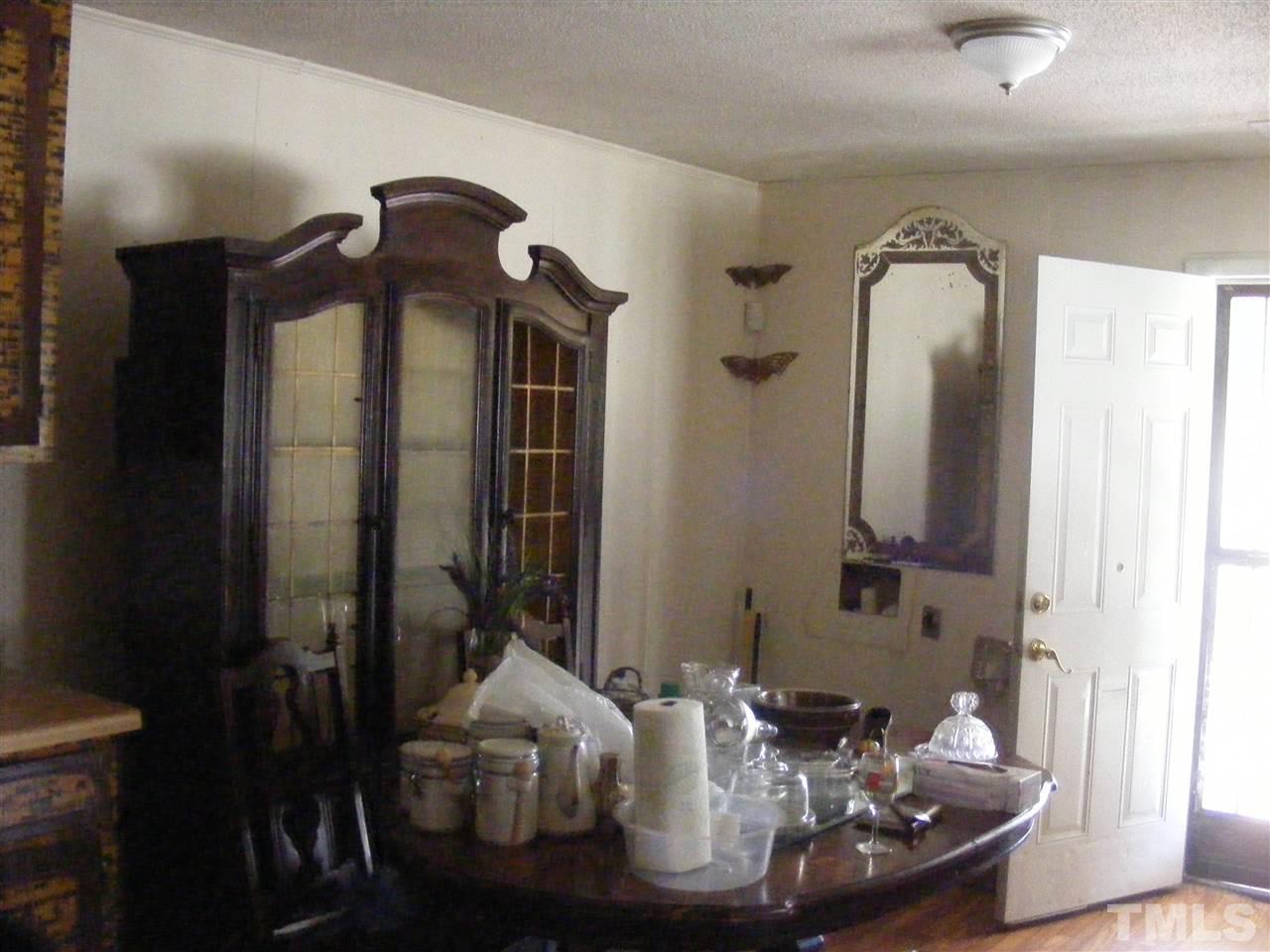900 Clayton Road Durham, NC 27703 - Photo 5 of 10 a view of a very nice looking dining room with a table and chairs