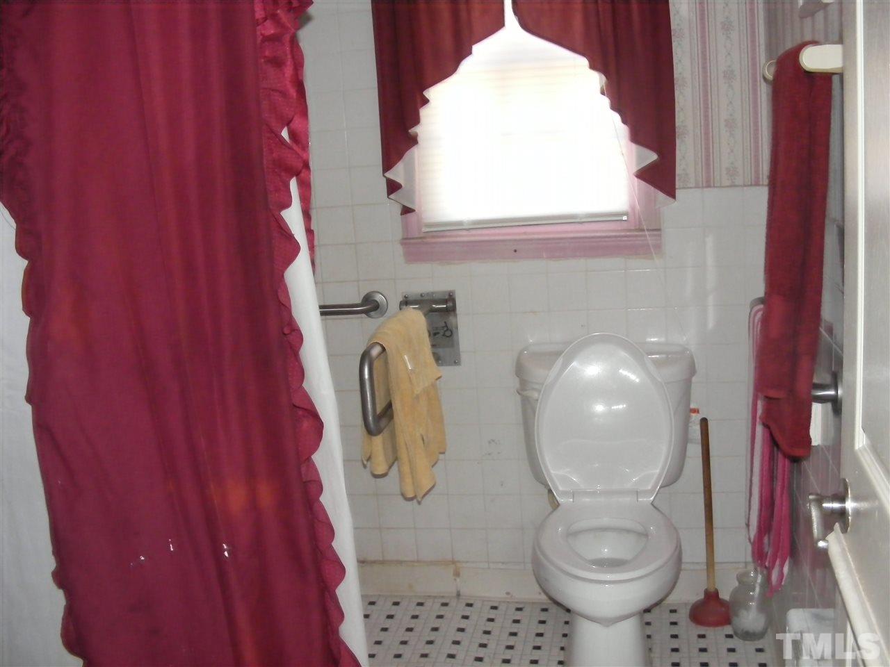 900 Clayton Road Durham, NC 27703 - Photo 7 of 10 a bathroom with a toilet and a sink