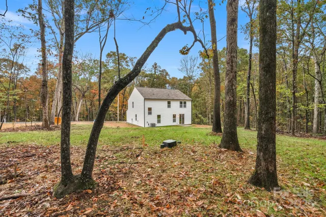a view of a house with a sink and a yard
