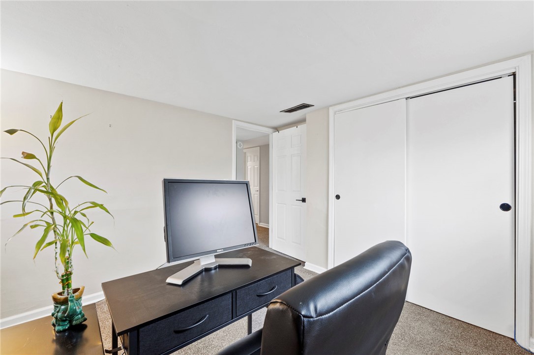 8180 Manning Road Germantown, OH 45327 - Photo 27 of 39 This versatile room offers a serene workspace with soft carpeted flooring.