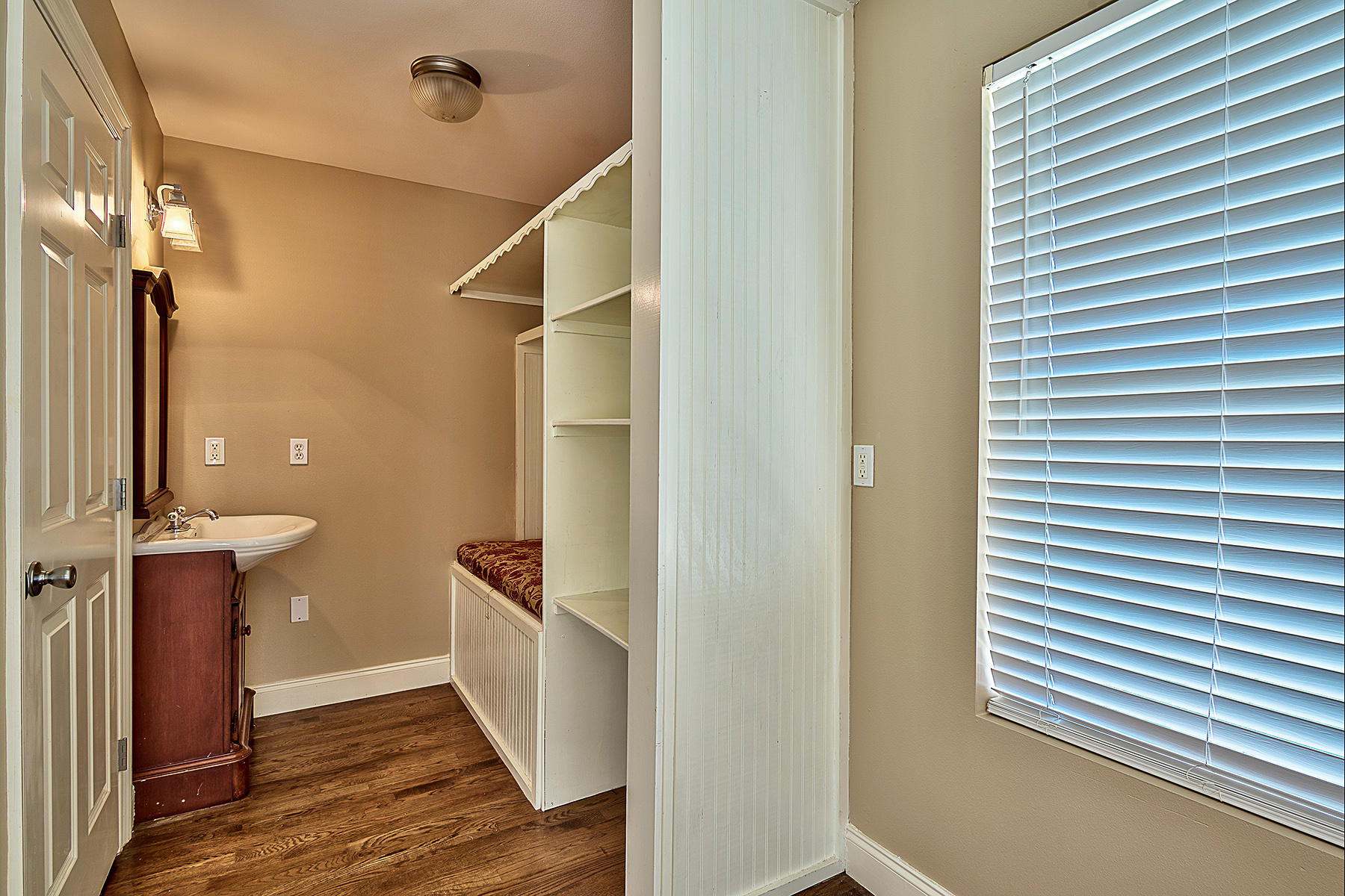 239 Inverrary Drive Destin, FL 32541 - Photo 11 of 20 a view of a hallway with wooden floor and staircase