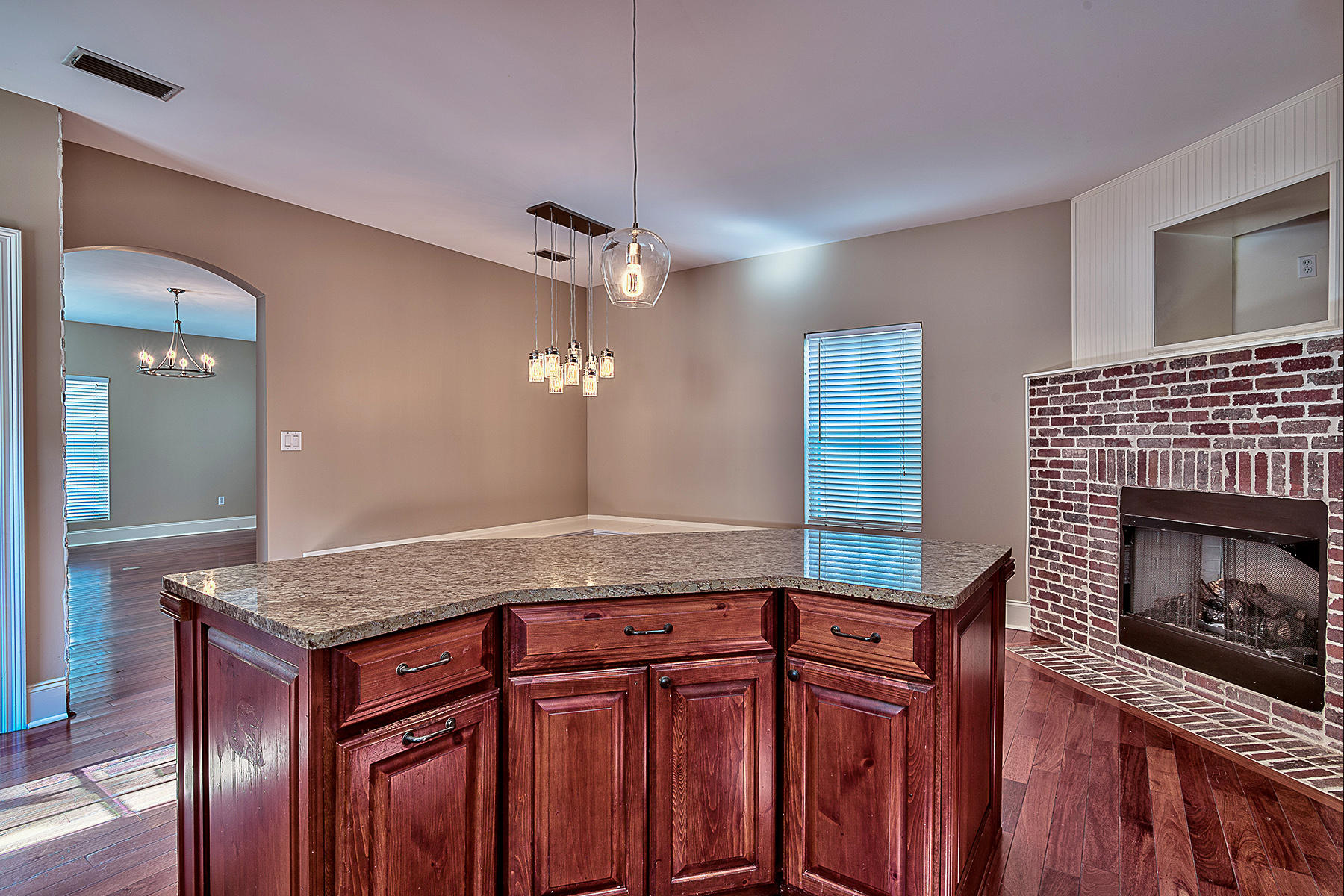 239 Inverrary Drive Destin, FL 32541 - Photo 12 of 20 a bath room with granite countertop kitchen island stainless steel appliances and living room view
