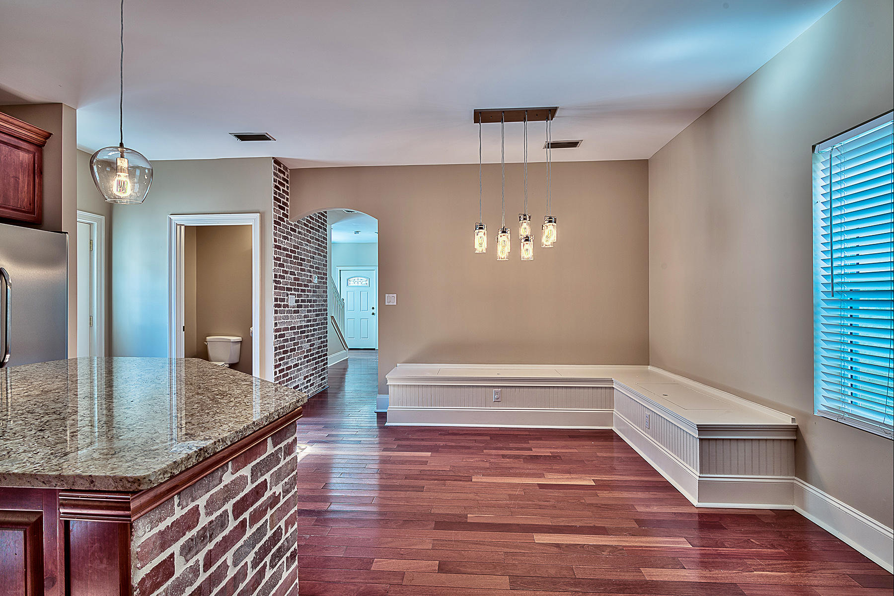 239 Inverrary Drive Destin, FL 32541 - Photo 14 of 20 a view of a hallway with wooden floor and staircase