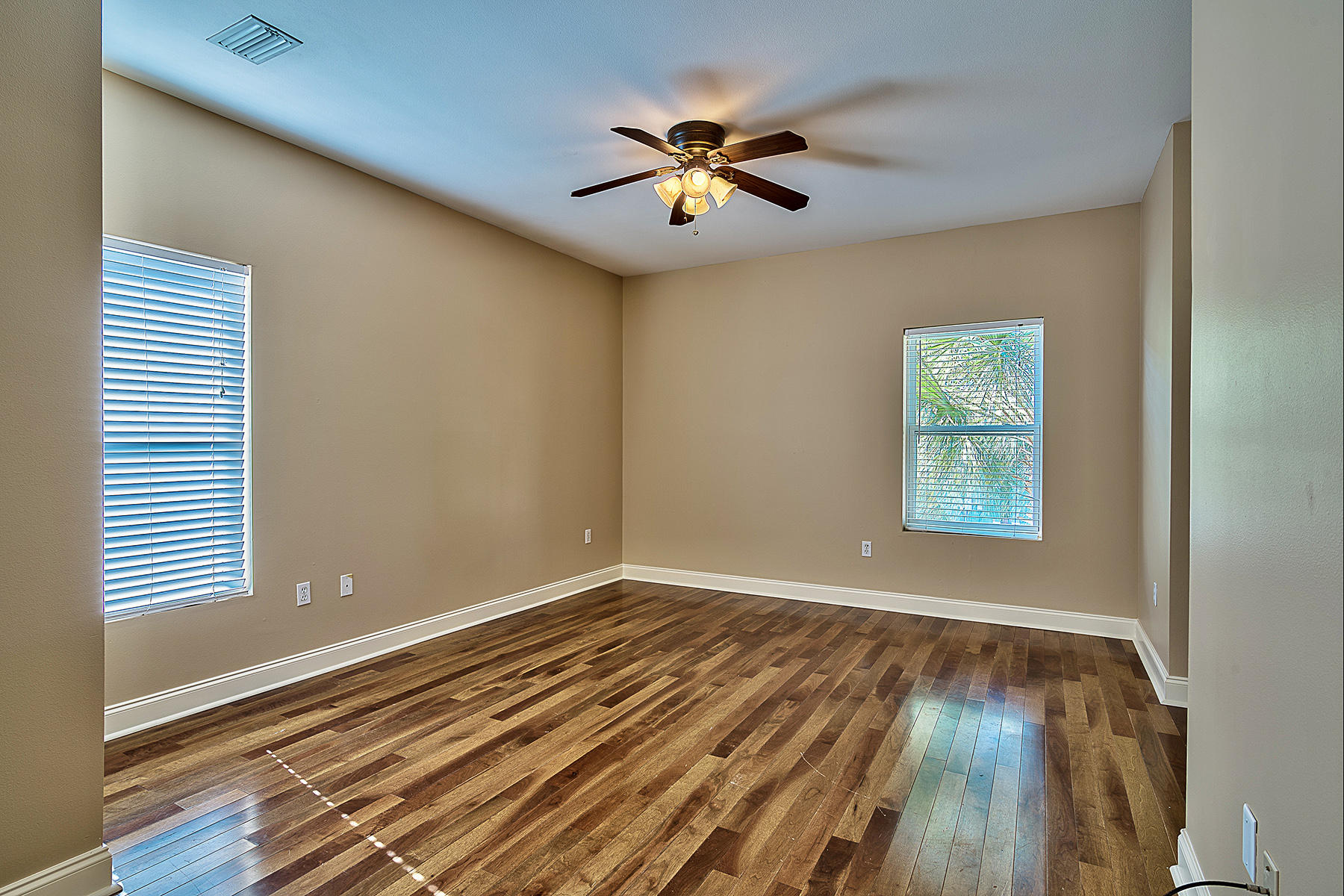 239 Inverrary Drive Destin, FL 32541 - Photo 17 of 20 wooden floor in an empty room with a window