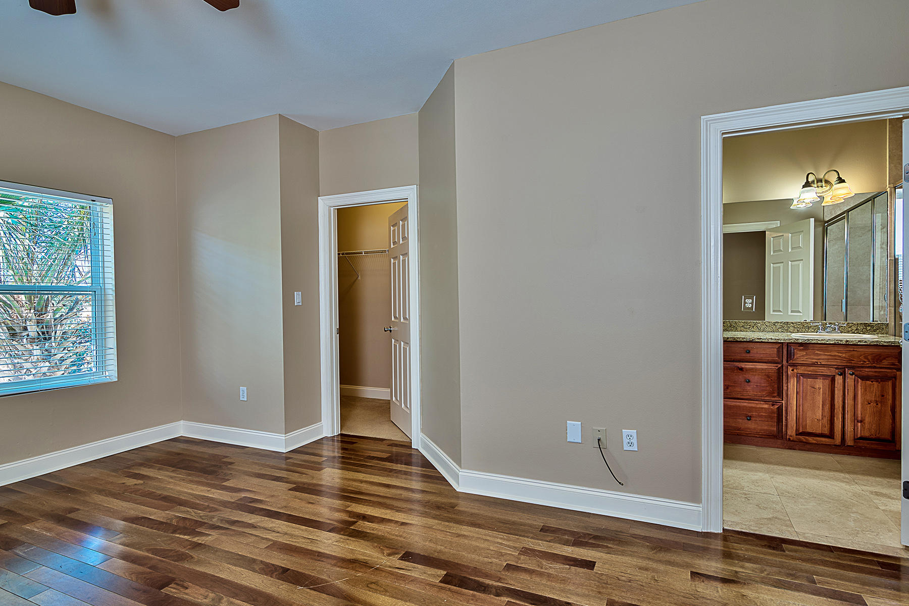 239 Inverrary Drive Destin, FL 32541 - Photo 18 of 20 wooden floor in an empty room with a window