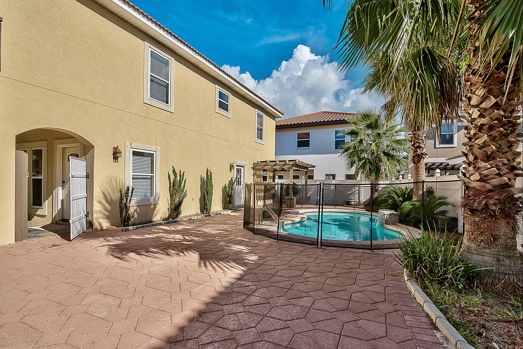 239 Inverrary Drive Destin, FL 32541 - Photo 19 of 20 a view of a house with a patio
