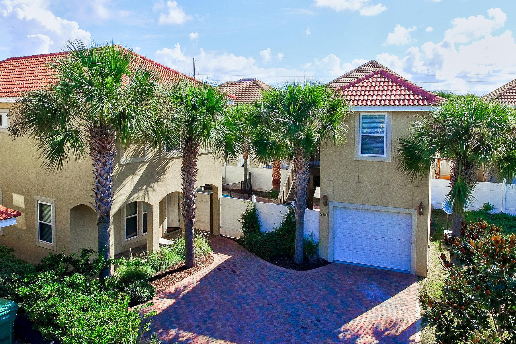 239 Inverrary Drive Destin, FL 32541 - Photo 20 of 20 a front view of a house with a garden