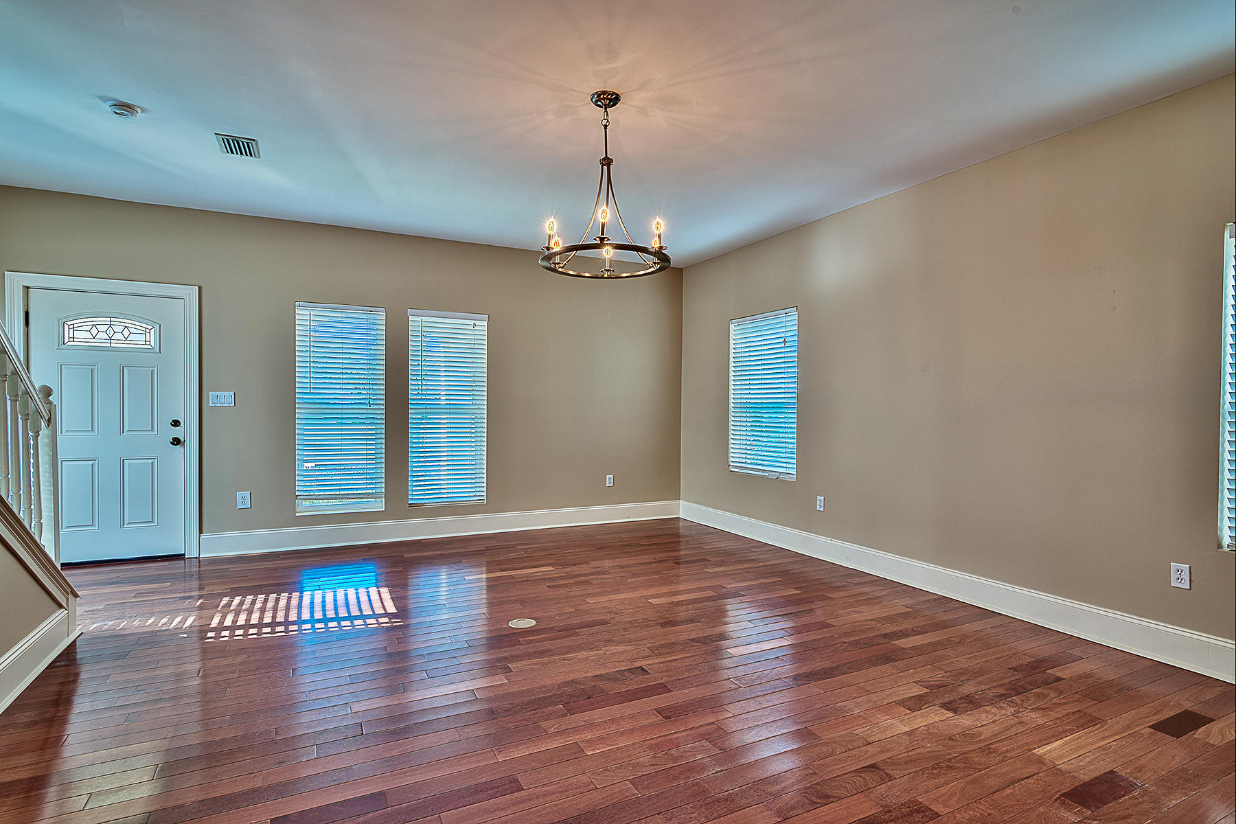 239 Inverrary Drive Destin, FL 32541 - Photo 4 of 20 wooden floor in an empty room with a window