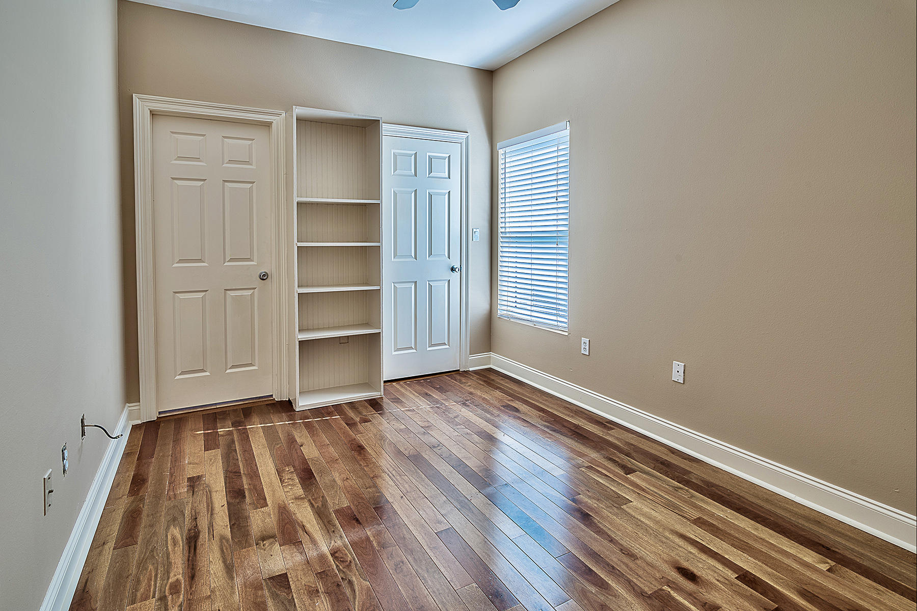 239 Inverrary Drive Destin, FL 32541 - Photo 7 of 20 a view of a room with wooden floor and closet