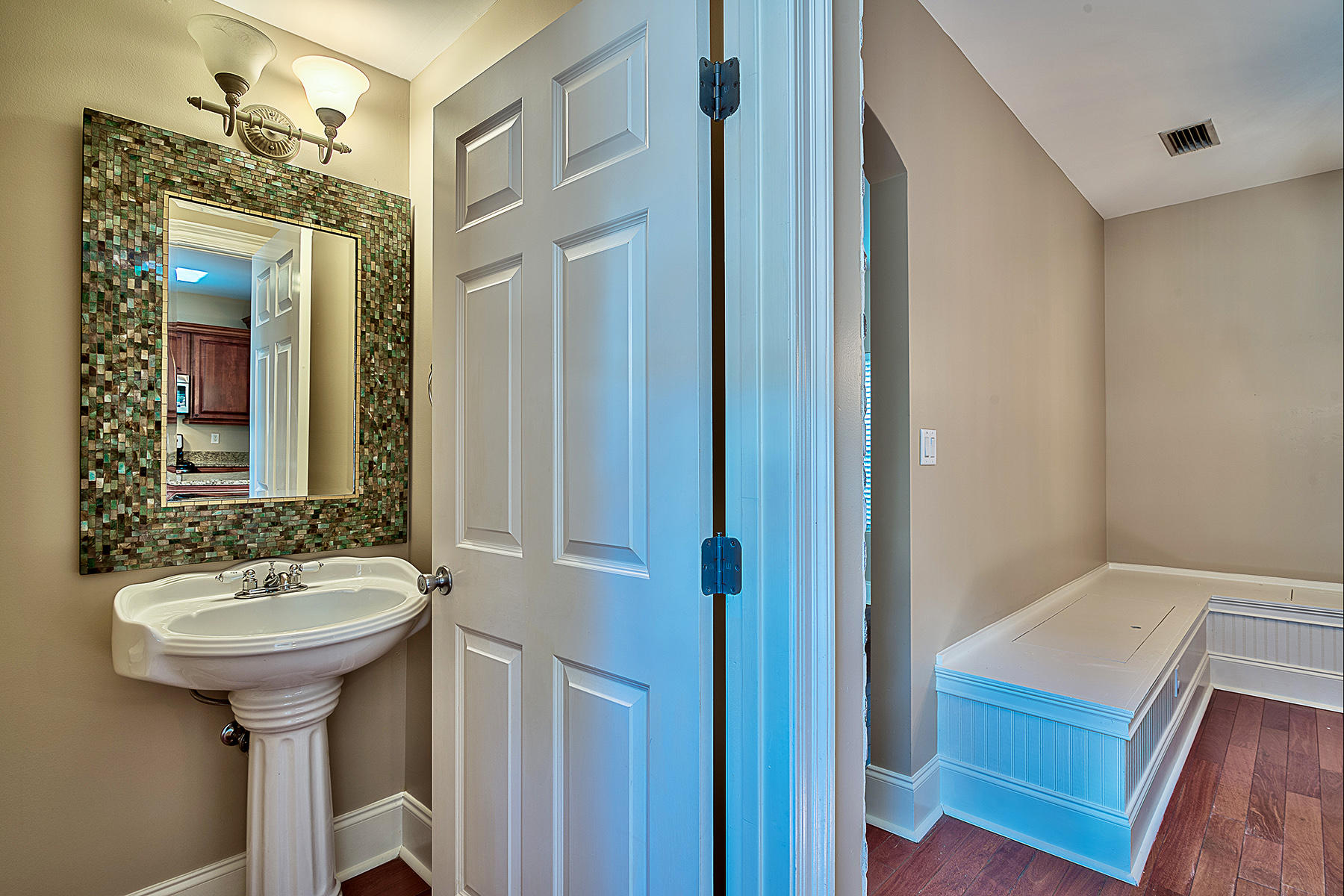 239 Inverrary Drive Destin, FL 32541 - Photo 9 of 20 a bathroom with a sink and a mirror
