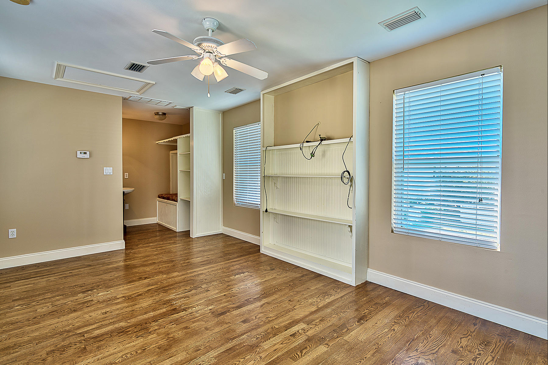 239 Inverrary Drive Destin, FL 32541 - Photo 10 of 20 a view of an empty room with a window and a kitchen