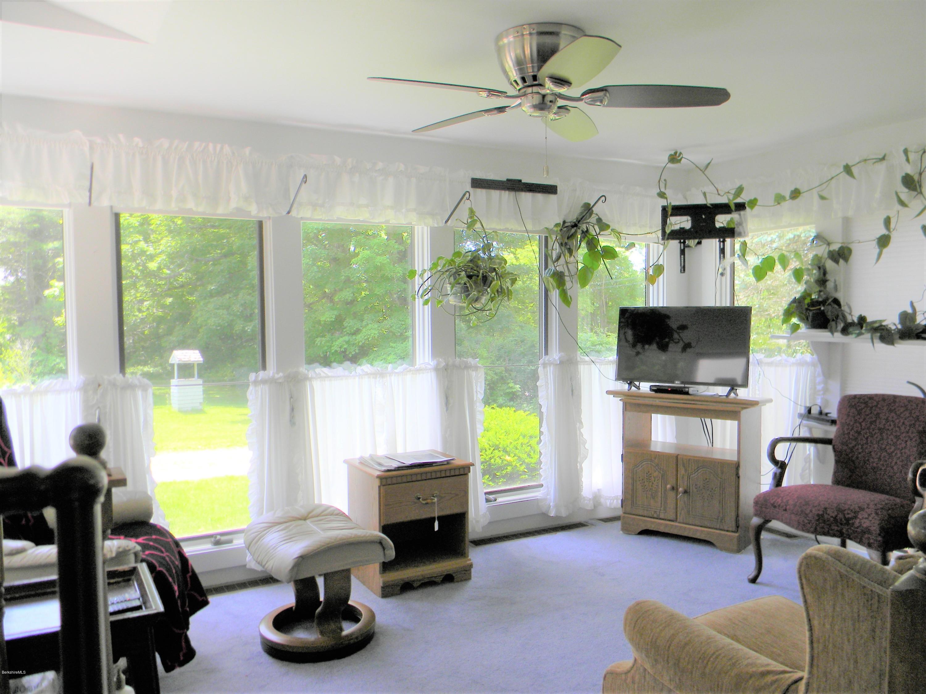 995 Dublin Road Richmond, MA 01254 - Photo 2 of 13 a view of a livingroom with furniture and a flat screen tv