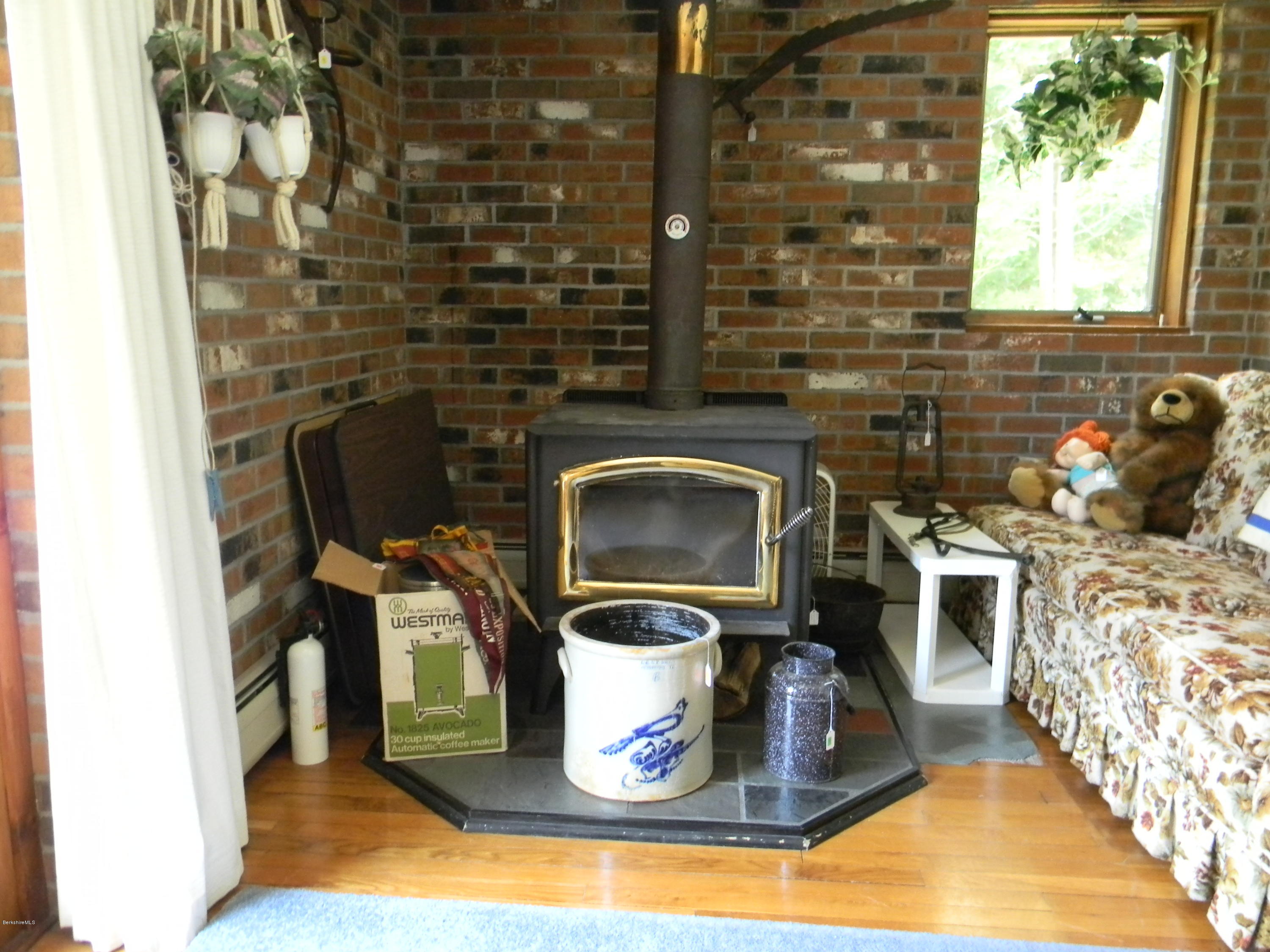 995 Dublin Road Richmond, MA 01254 - Photo 6 of 13 a kitchen with a stove and a wooden floor