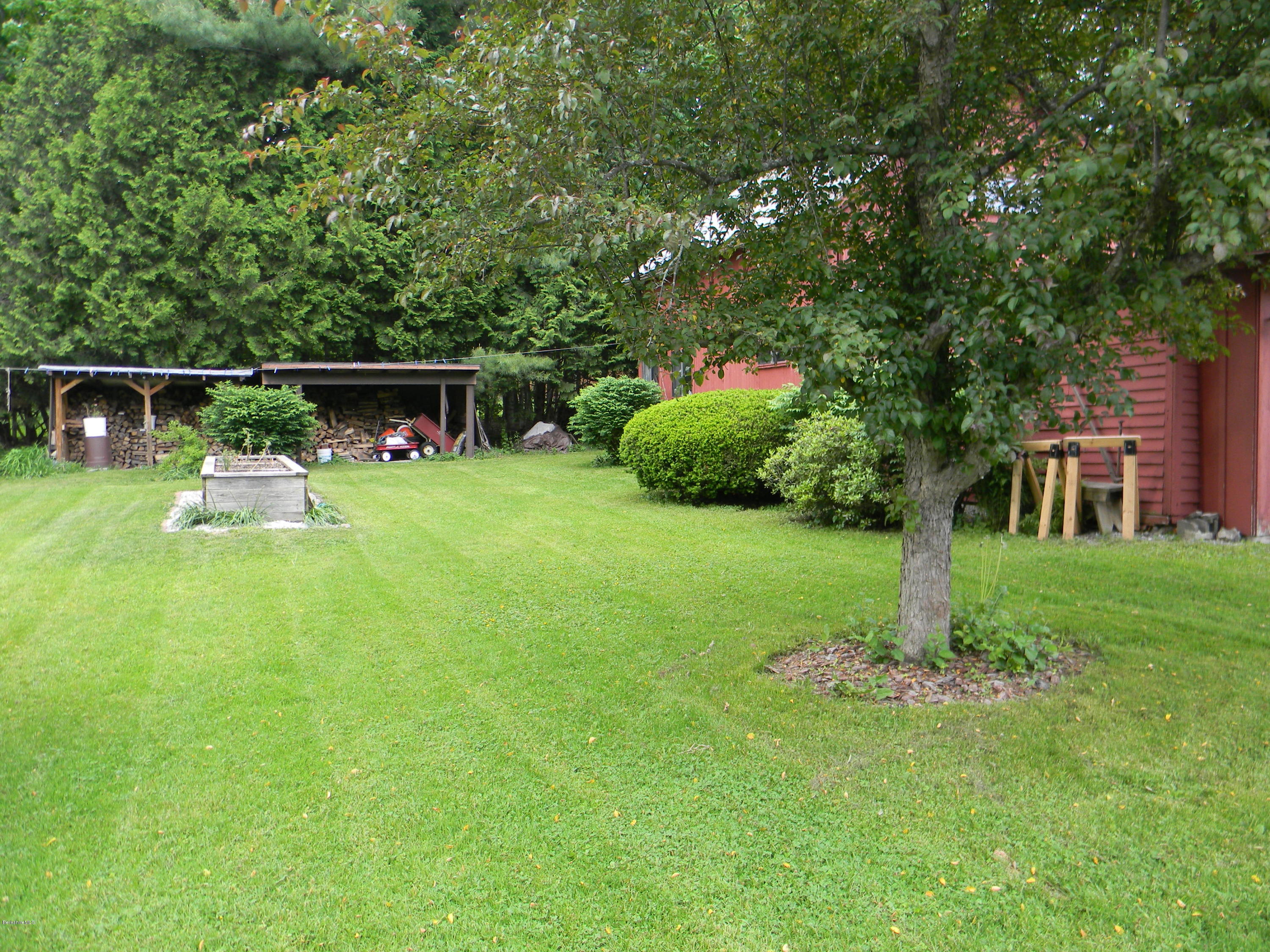 995 Dublin Road Richmond, MA 01254 - Photo 10 of 13 a front view of a house with backyard and sitting area