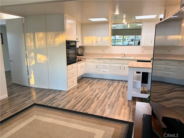 a kitchen with a sink and cabinets