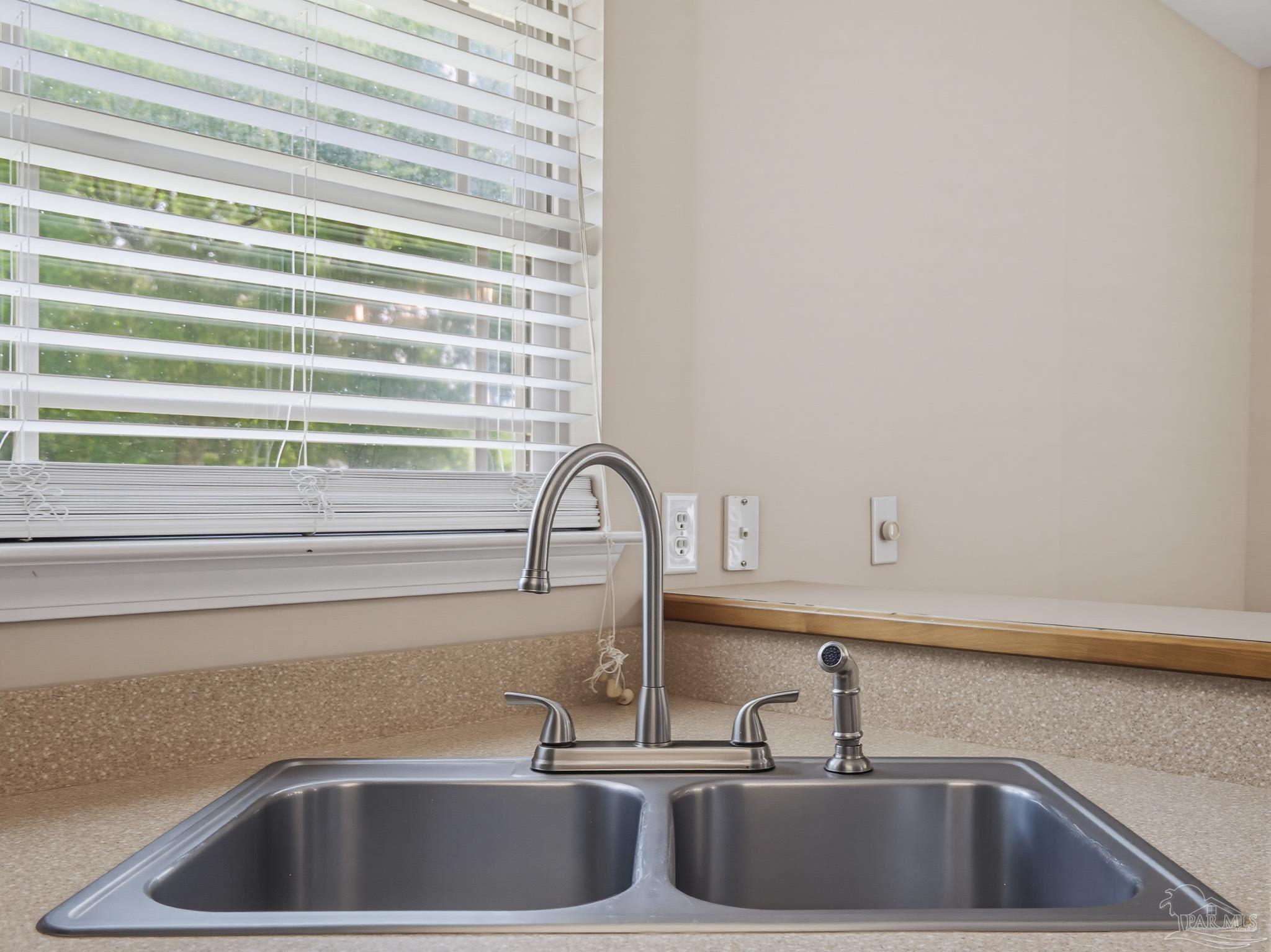 5567 Jones Street Milton, FL 32570 - Photo 17 of 48 a close view of sink and tap