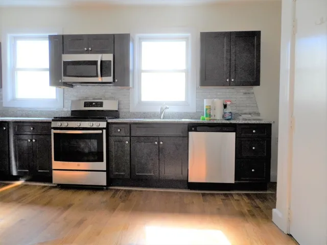 a kitchen with a sink and a stove