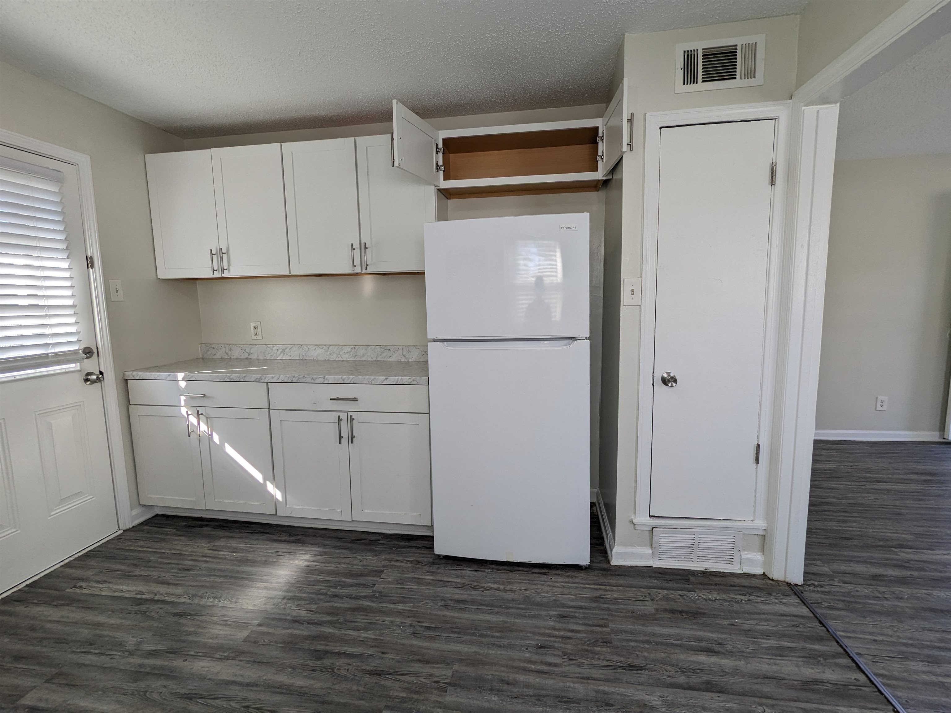 4499 Range Line Road Memphis, TN 38127 - Photo 9 of 10 a white refrigerator freezer sitting inside of a kitchen