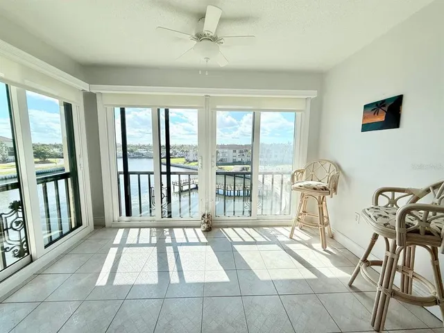 a view of a room with balcony and furniture