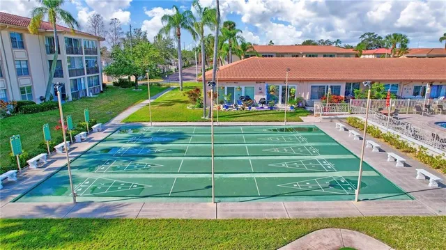 a view of a swimming pool with a garden and plants