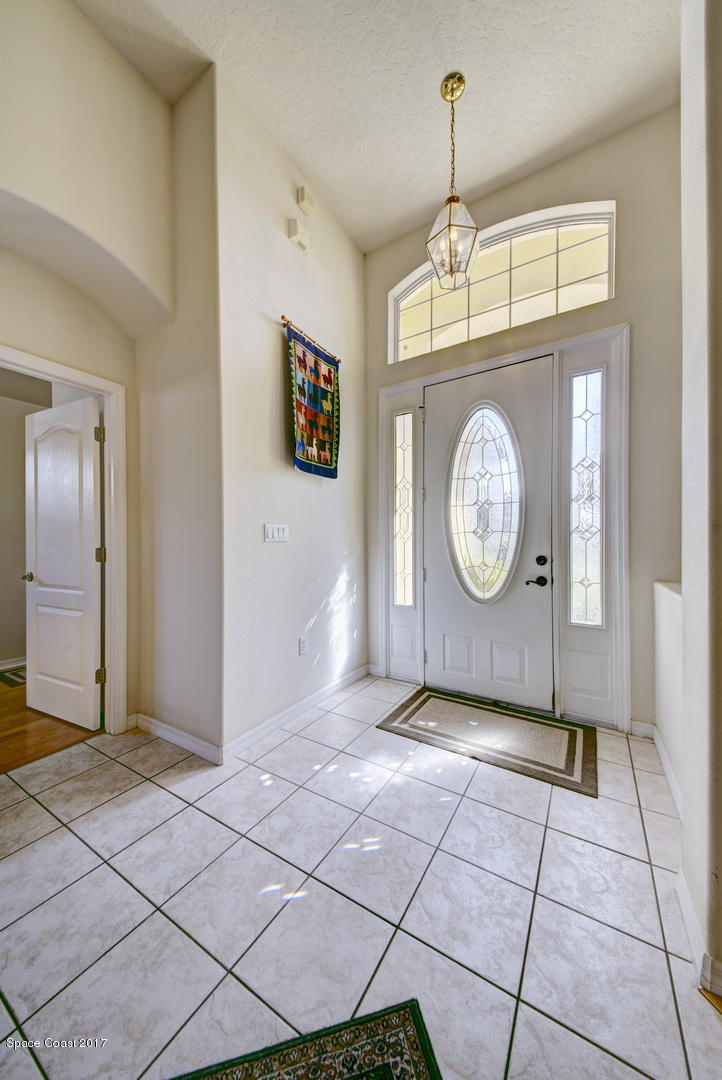 1662 Long Pine Road Melbourne, FL 32940 - Photo 7 of 52 Foyer Tile Floor Entry