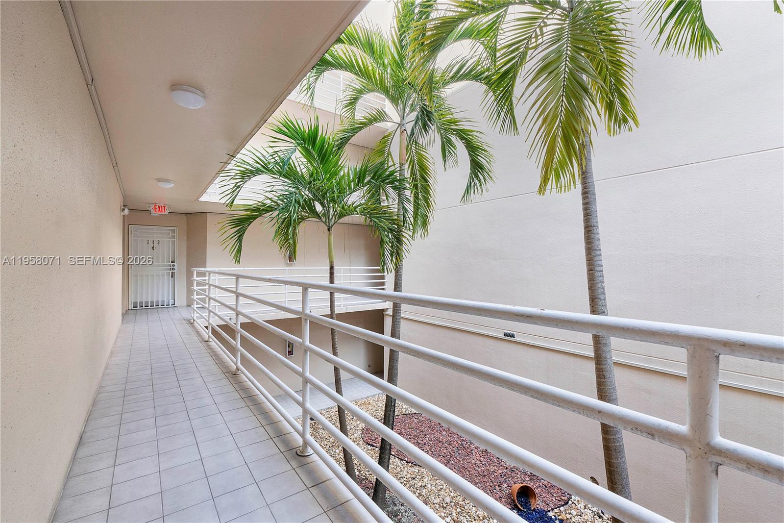8050 Northwest 8th Street, Unit 1203 Miami, FL 33126 - Photo 14 of 14 a view of balcony with a potted plant