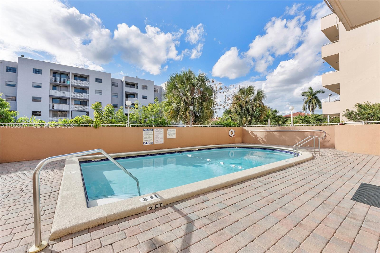 8050 Northwest 8th Street, Unit 1203 Miami, FL 33126 - Photo 2 of 14 a view of outdoor space with swimming pool