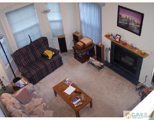 199 Nebula Road Piscataway, NJ 08854 - Photo 3 of 10 a living room with furniture and a flat screen tv