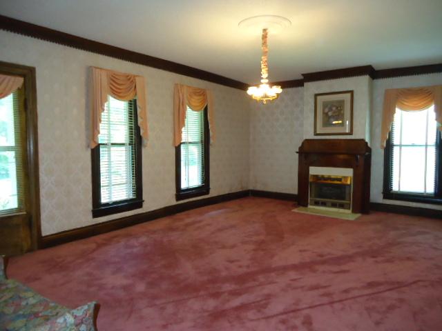 216 North Walnut Street Springfield, TN 37172 - Photo 7 of 20 Liivng room as you enter the home. Fireplace with gas heat. Beautiful woodwork around all windows in home