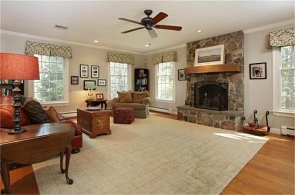 9 Pembroke Road Wellesley, MA 02482 - Photo 5 of 7 a living room with furniture and a fireplace